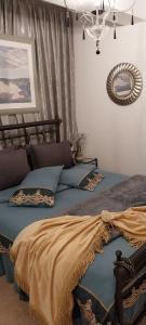 Postel nebo postele na pokoji v ubytování Ariadnis Apartment