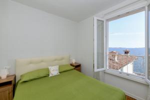 En eller flere senge i et værelse på MGH - Lake View Terrace Gardone