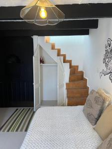 Ένα ή περισσότερα κρεβάτια σε δωμάτιο στο Casita hermosa En el centro