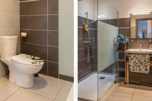 a bathroom with a toilet and a shower at Casa Pouty Beach in Bastia +14 photos