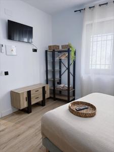 Кровать или кровати в номере Hostal La Casa Del Escudo