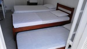 Ένα ή περισσότερα κρεβάτια σε δωμάτιο στο Cantinho da Praia