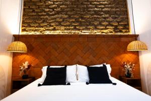 Un pat sau paturi într-o cameră la Casa Sofi Oaxaca +76 fotografii