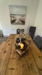 a wooden table with a bunch of items on it at Nancie's Place - DARTMOUTH TOWN CENTER with PRIVATE PARKING - A Traditional Georgian PRIVATE DUPLEX APARTMENT - BEAUTIFULLY REFURBISHED - TWO BEDROOMS, BATHROOM, KITCHEN and LOUNGE DINER in Dartmouth