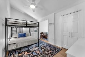 a bedroom with a bunk bed with a teddy bear on the floor at Montgomery Ranch - Main House in Redding +17 photos