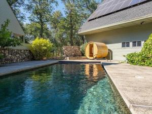 a swimming pool in the yard of a house at Montgomery Ranch - Main House in Redding