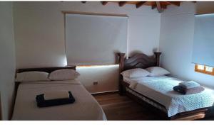 En eller flere senge i et værelse på Villa marinilla