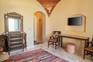 Μια τηλεόραση ή/και κέντρο ψυχαγωγίας στο Lake House by Tunisia Green Resort