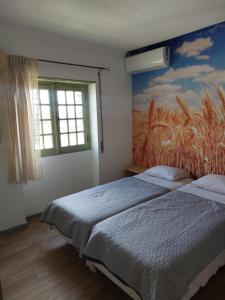 Postel nebo postele na pokoji v ubytování Casa da Ermida Cottage with Jacuzzi and fantastic views