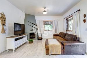 Μια τηλεόραση ή/και κέντρο ψυχαγωγίας στο Sítio 4 Estações | Paz e Natureza