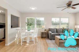a living room with a couch and a table at Spacious Zephyrhills Duplex #1 in Zephyrhills