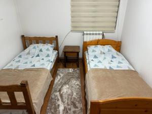 Postel nebo postele na pokoji v ubytování PIN