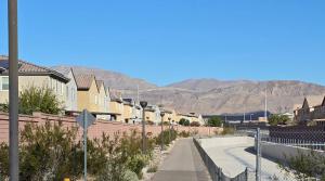 a street of houses with mountains in the background at 2-Bedroom Entire Guest Suite in North Las Vegas Mountain Views in Las Vegas