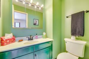 a bathroom with a sink and a mirror and a toilet at 4 Mi to Bromley Mtn Family-Friendly Retreat! in Landgrove Town Center +26 photos