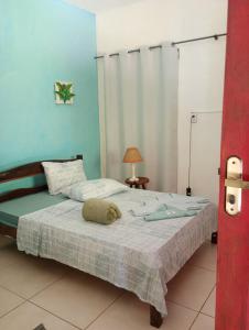 Postel nebo postele na pokoji v ubytování Onça Parda Hospedagens com Cachoeira Privativa