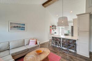 a living room with a couch and a table at Walk to Beach and Dtwn Dining! Avalon Coastal Escape in Avalon