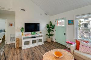a living room with a tv and a couch at Walk to Beach and Dtwn Dining! Avalon Coastal Escape in Avalon