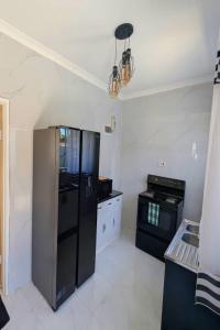 Η κουζίνα ή μικρή κουζίνα στο Yeta Apartments