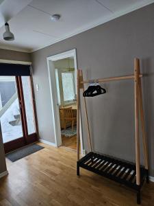 a room with a room with a table and a door at Downtown apartment in Svolvær in Svolvær +12 photos