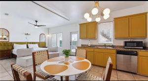 a kitchen and living room with a table and chairs at 14334appt101 in Corpus Christi