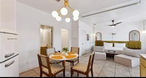 a living room with a table and chairs and a couch at 14334appt101 in Corpus Christi