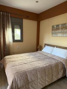 Ένα ή περισσότερα κρεβάτια σε δωμάτιο στο Papi's Cozy Apartment