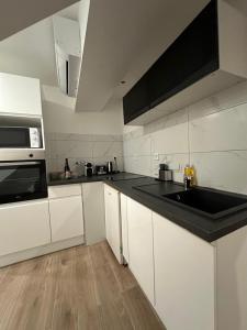 Η κουζίνα ή μικρή κουζίνα στο Appartement Douceur +4 φωτογραφίες
