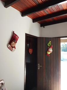 a room with a door with a christmas decorations at Hostel pousada floresta in Joinville