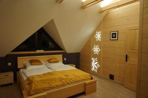a bedroom with a large bed in a room at Oaza Szczęścia in Koniaków