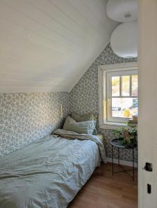 Ένα ή περισσότερα κρεβάτια σε δωμάτιο στο Lundenhuset 1917 - in the heart of Ulsteinvik