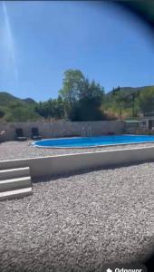 a view of a swimming pool with blue water at Bela & Mare in Blace +11 photos