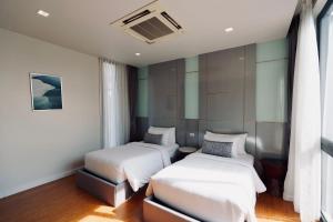 Ένα ή περισσότερα κρεβάτια σε δωμάτιο στο Private Villa at Mida Grande Resort +39 φωτογραφίες