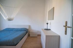 Postel nebo postele na pokoji v ubytování P&P Bergamo Apartment