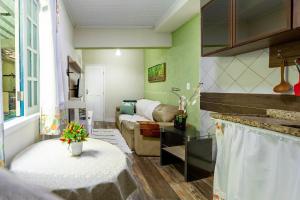 Khu vực ghế ngồi tại Casa Aconchegante +7 ảnh