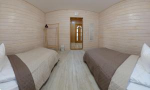 Postel nebo postele na pokoji v ubytování Nad Hukom Hostel