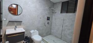 a bathroom with a shower and a toilet and a sink at Hotel gym club33 in Huancayo +28 photos