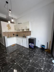 Kuchyň nebo kuchyňský kout v ubytování Dajon-6 Family Suite