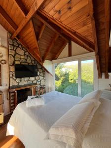 Ένα ή περισσότερα κρεβάτια σε δωμάτιο στο Refugio Giardino