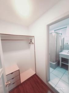 a bathroom with a shower and a sink at Hotel Grer By Chat Noir in Cuenca