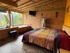 Ένα ή περισσότερα κρεβάτια σε δωμάτιο στο Glamping Cabaña Pacha Neusa