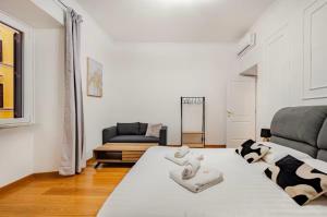 Postel nebo postele na pokoji v ubytování Casilina Luxury Apartment + 13 fotografií