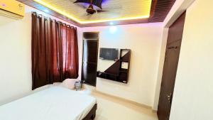 Ένα ή περισσότερα κρεβάτια σε δωμάτιο στο HOTEl MJ INN