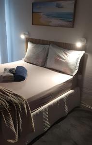 En eller flere senge i et værelse på Lotf Romântico/com Ar Privativo