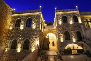 a building with lights on it at night at Mara Loya Konağı in Mardin
