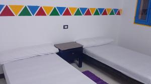 Ένα ή περισσότερα κρεβάτια σε δωμάτιο στο Shellaly Ca Nubian Guest House
