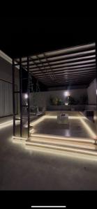 an empty room with lights in a building at شالية لانتانا الطائف الواصلية in As Sayl aş Şaghīr