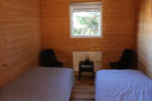 Ένα ή περισσότερα κρεβάτια σε δωμάτιο στο Åsele Camping and Holliday homes