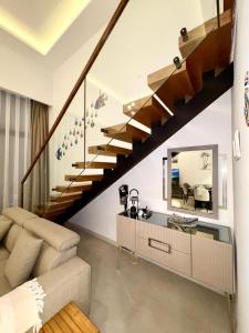 a living room with a staircase and a mirror at 3 bedrooms villa with own pool! in Pano Dheftera