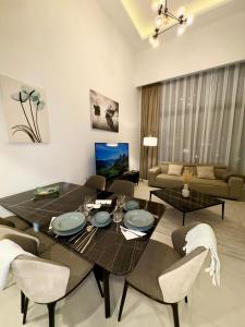 a living room with a dining table and chairs at 3 bedrooms villa with own pool! in Pano Dheftera