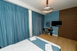 Μια τηλεόραση ή/και κέντρο ψυχαγωγίας στο Luz&LukRooms